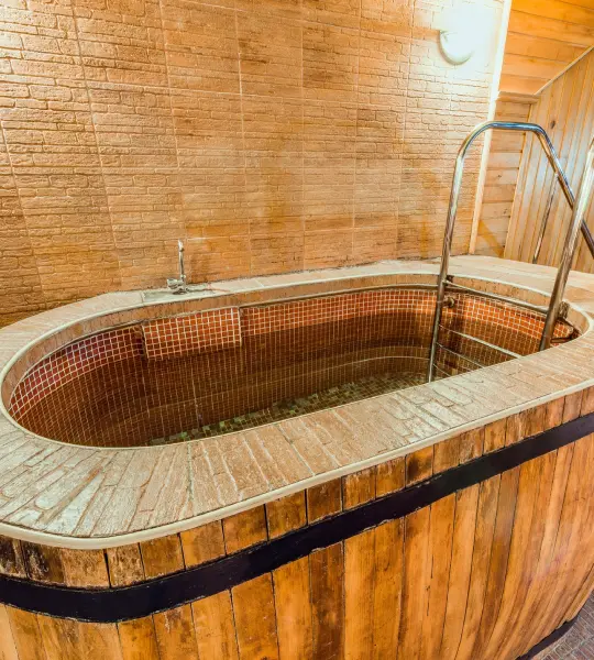 Wooden soaking bathtub in a sauna